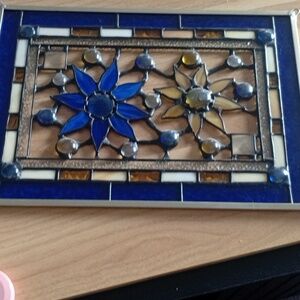 Beautiful stained glass flower yellow and blue dark amber. Bought from Etsy.